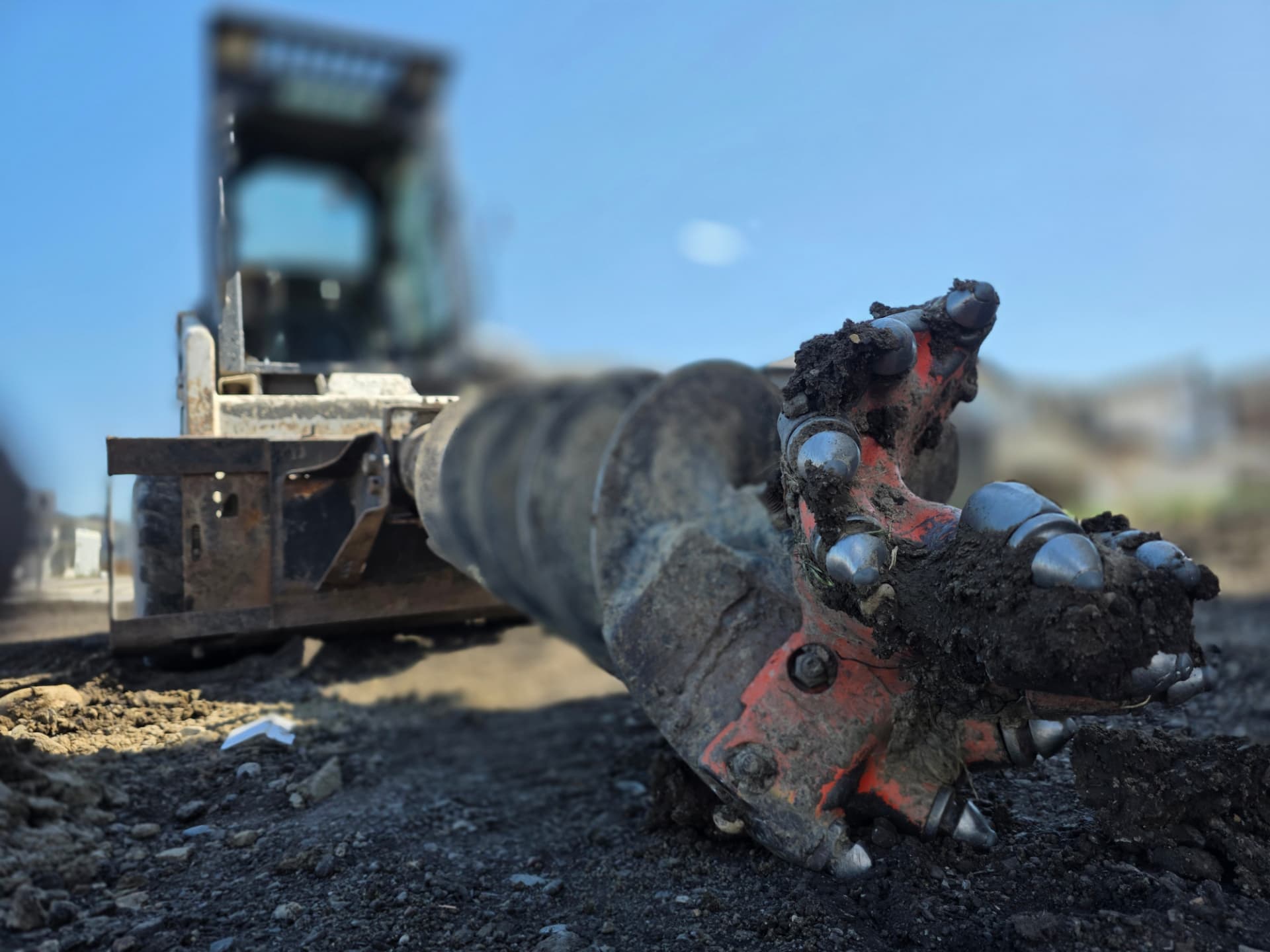 Skid-steer auger attachment used for post holes